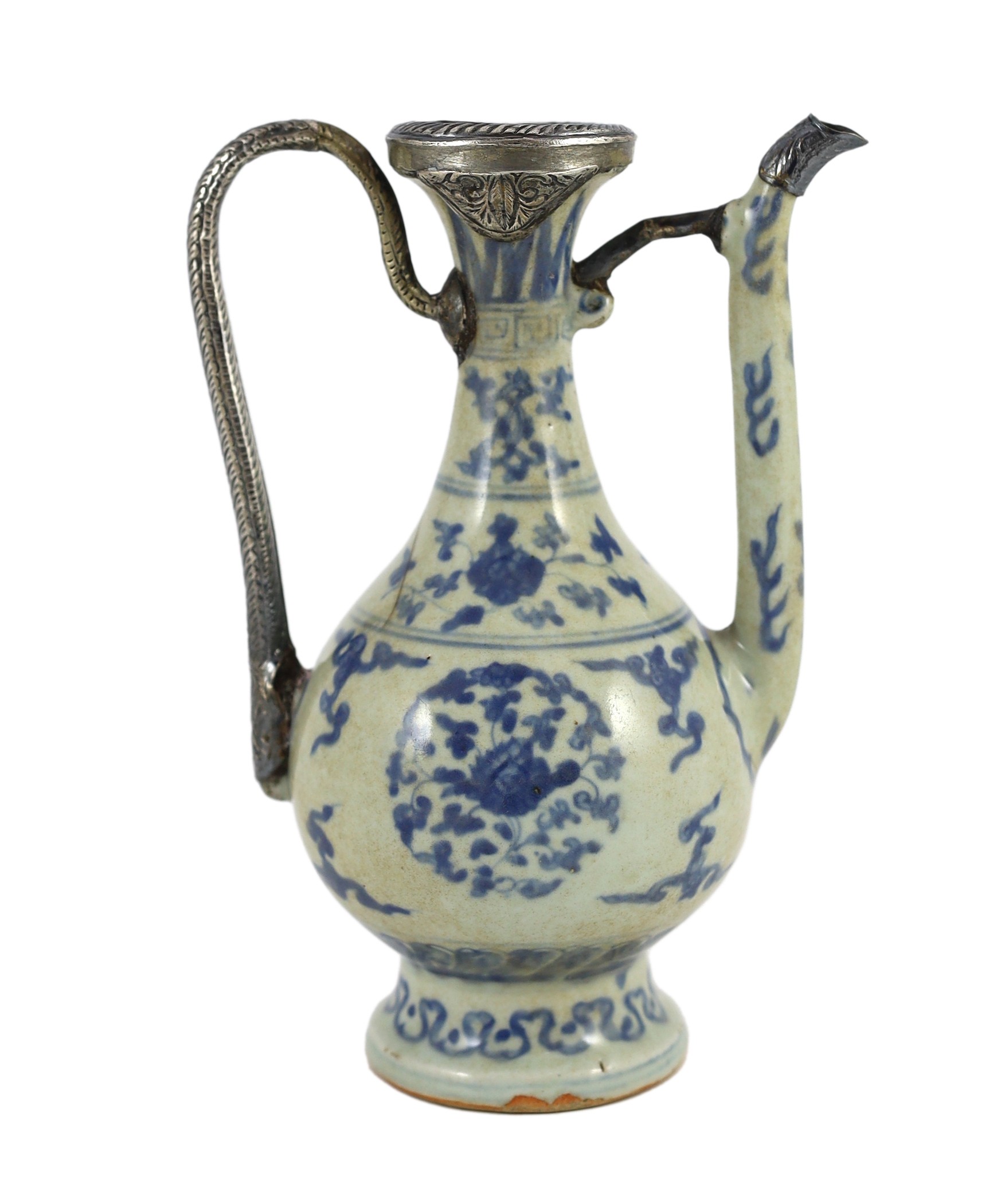 A Chinese late Ming blue and white ewer, made for the Islamic market, Jiajing to Wanli period, 21cm high, damage and later Islamic silver mounts